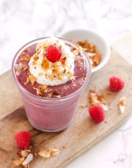 Delightfully fruity and surprisingly low in sugar, this high-protein Raspberry Cream Pie Smoothie is a must-make this summer! Recipe via Eat Spin Run Repeat