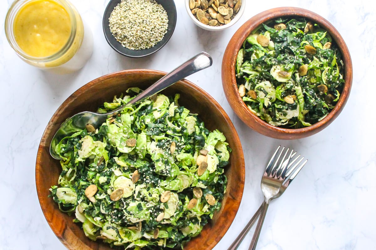 This Massaged Kale and Brussels Sprout Salad with Maple Tahini Dressing is packed with fiber, vitamins and minerals, healthy fats and plenty of crunch from hemp and pumpkin seeds. | My Fresh Perspective | #vegan #paleo #thanksgiving #sugardetox #antiinflammatory
